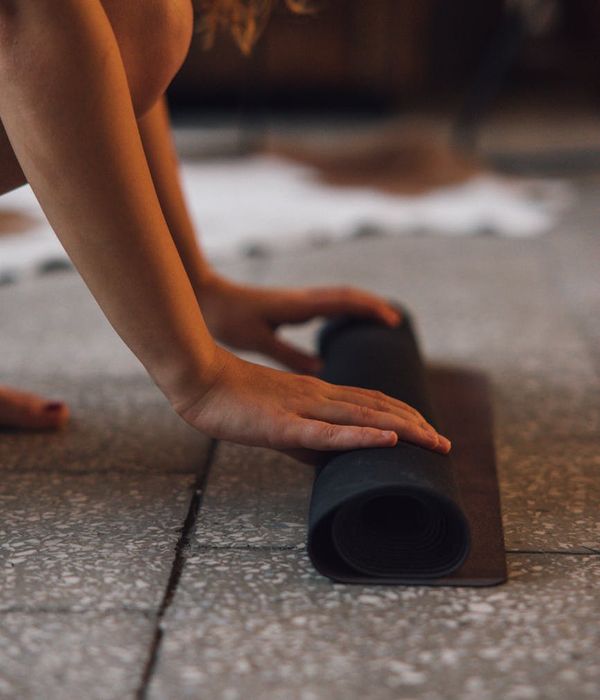 Close-up on hands positioned carefully on a yoga mat during a pose.